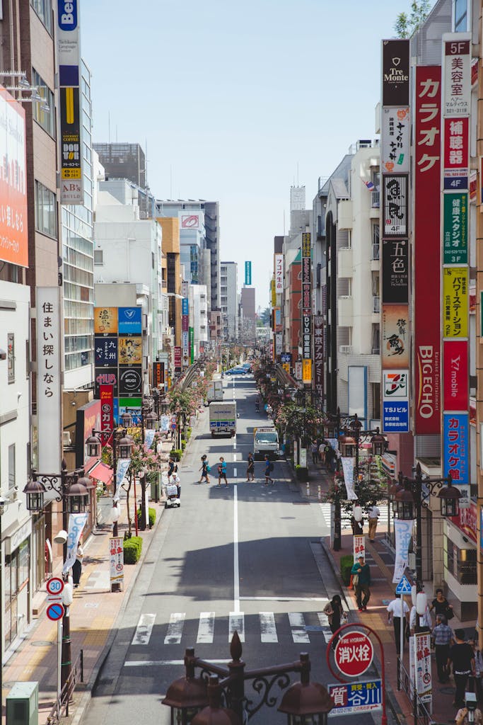 Bustling day in Tokyo's vibrant shopping district with colorful signage and busy streets.